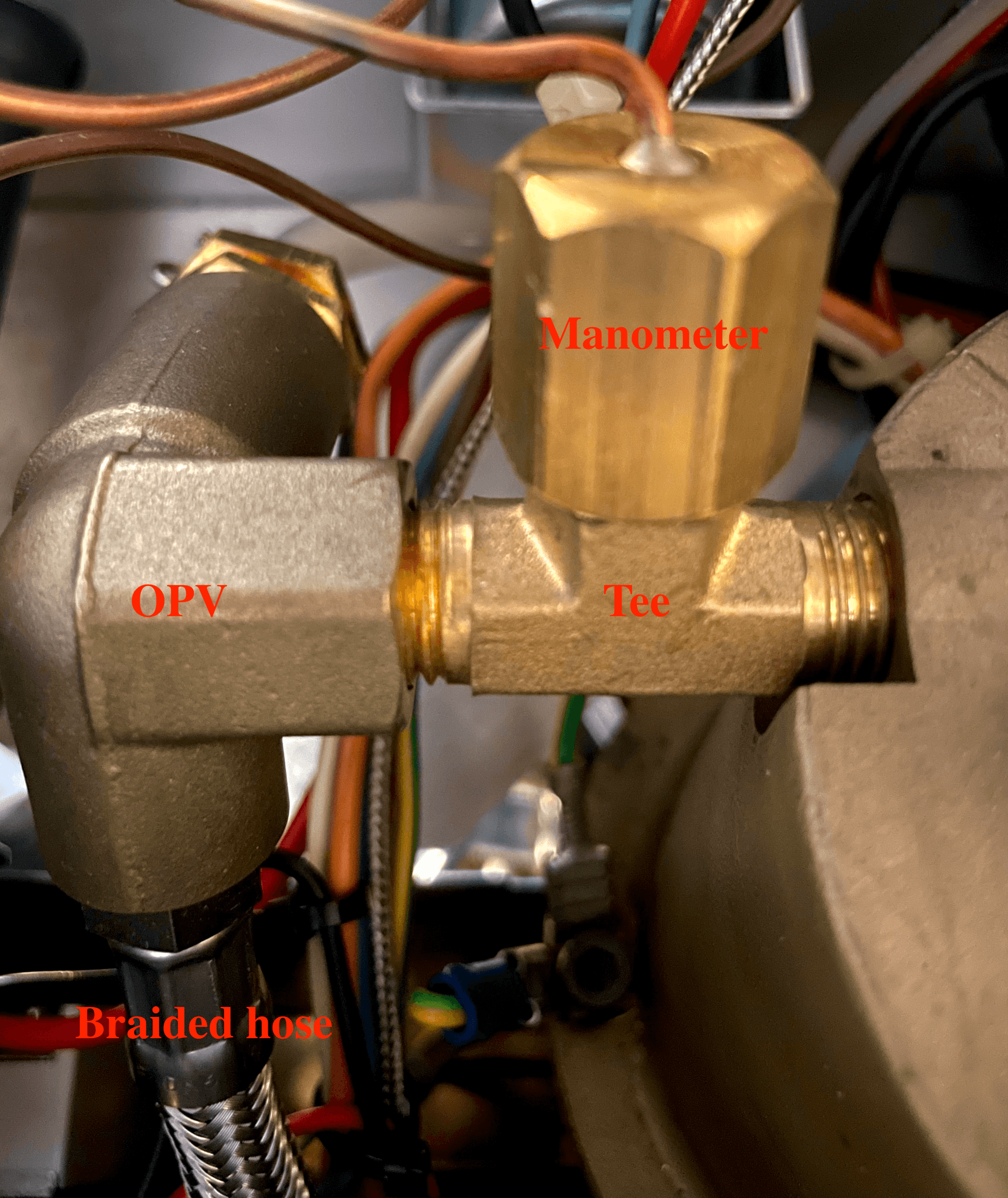 Inside machine after replacement of OPV, braided hose and installation of BSP tee.